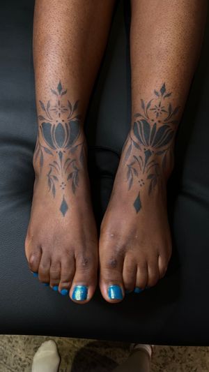 Ornamental feet tattoos 