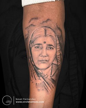 A portrait that tells the story of unconditional love of Mom Tattoo made by Novel Fernandez at Circle Tattoo Andheri 