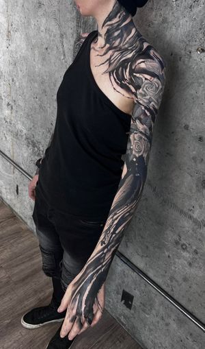 Get a hauntingly beautiful sleeve tattoo with intricate blackwork and ornamental designs by Rachel Aspe at Bellatrix Tattoo.