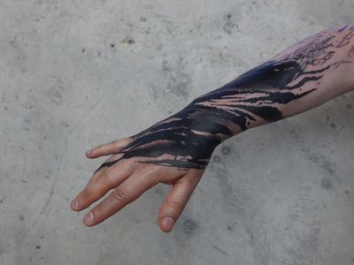 Get a spooky blackwork horror tattoo on your hand by Rachel Aspe at Bellatrix Tattoo for a unique and haunting look.