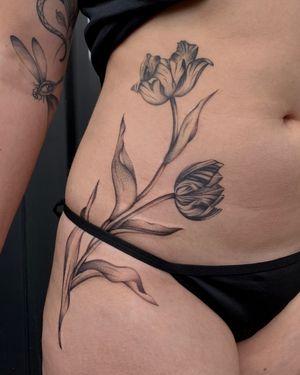 Beautiful flower design by Ophelya Jeandat, perfect for a subtle and feminine hip tattoo.
