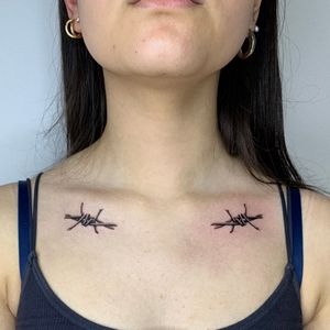 Intricate dotwork and micro-realism tattoo design featuring barbed wire and thorns by Ophelya Jeandat.