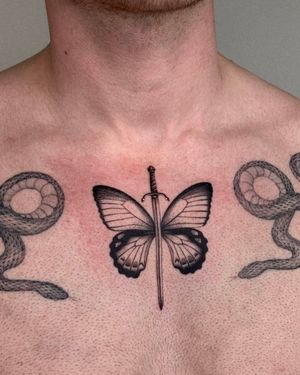 Discover a stunning fusion of delicate dotwork and fine lines in this jaw-dropping butterfly and sword design by Ophelya Jeandat.