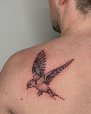 Unique black_and_gray illustrative tattoo by Ophelya Jeandat, featuring a beautiful swallow design created in intricate dotwork style.