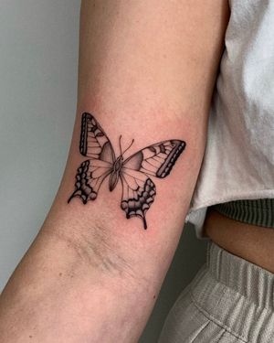 Embrace the beauty of nature with this fine line illustrative butterfly tattoo created by the talented artist Ophelya Jeandat.