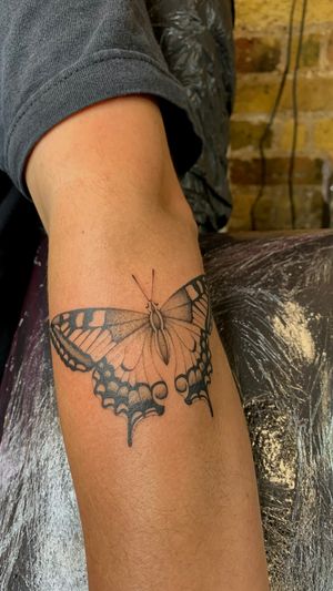 A stunning fine line and illustrative butterfly tattoo design by skilled artist Ophelya Jeandat. Perfect for a delicate and beautiful look.
