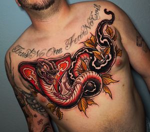 Experience the power and beauty of a neo-traditional cobra tattoo by the talented artist Adrian Suez. Incorporating elements of new school and illustrative styles.