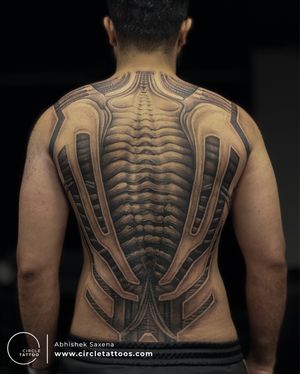 Best back piece biomechanical The portrayal here is not just exhibiting an incredible piece of art but in fact a story depiction that will stay for life now. This is a real showcase of strength, willpower & immense courage of the client who had an unrepairable back injury & after months of training has come out stronger than before. Now we may say "It has been sewed". The idea was beautifully absorbed & designed to perfection matching the thought process by our artists Vibhor Chauhan & Piyush Kumar & flawlessly brought to life by our artist Abhishek Saxena 