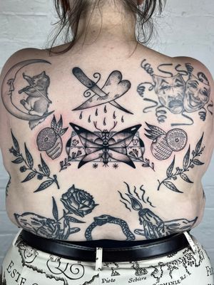 Unique blackwork design featuring a moth, heart, dagger, patchwork, and orange elements. Perfect for bold statement on your back.