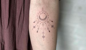 Elegant forearm tattoo featuring a moon and star design created with meticulous dotwork technique by Indigo Forever Tattoos.