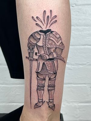Detailed dotwork armor and knight design on calf by Jack Henry Tattoo. Fine line and illustrative style.