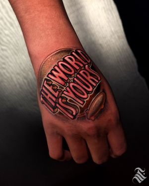 Unique tattoo design featuring a logo and blimp, created by the talented artist Adrian Suez.