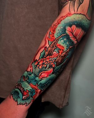 Get inked with an intricate dragon design by the talented artist Adrian Suez. A blend of traditional and modern styles.