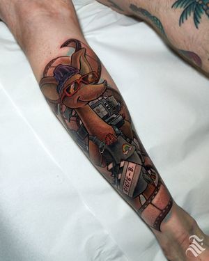 Neo-traditional meets new-school in this vibrant and detailed tattoo by Adrian Suez, featuring a playful kangaroo holding a camera.