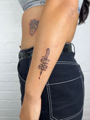Get the perfect blend of dotwork and fine line style with this illustrative heart and dagger design by Jack Henry Tattoo.
