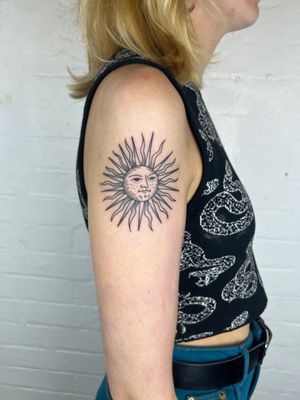 Experience the beauty of dotwork and fine line illustration with this radiant sun tattoo by Jack Henry Tattoo.