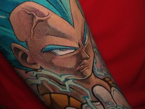Get the ultimate power with this epic anime tattoo by Adrian Suez, featuring Vegeta in his Super Saiyan form from Dragon Ball.