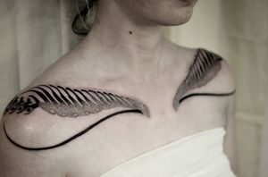 Explore the mesmerizing world of blackwork and abstract patterns with Iva M's unique tribal dotwork tattoos. Discover the beauty of intricate designs.