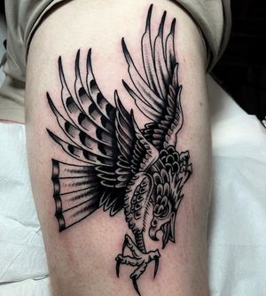 Impressive black and gray eagle design by Barney Coles for a timeless look on your upper arm.