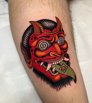 Get a bold and striking tattoo by the talented artist Barney Coles, featuring a devil and oni motif in traditional style.