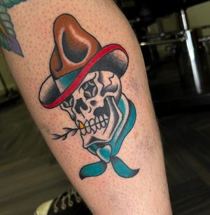 Neo traditional tattoo of a cowboy skull on the lower leg, done by artist Barney Coles