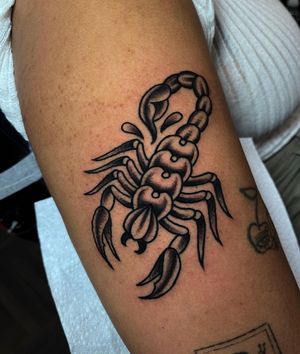 Get a fierce scorpion design on your arm with this illustrative traditional style tattoo by the talented artist Barney Coles.