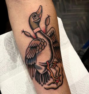 Vibrant and detailed forearm tattoo featuring a duck and goose in neo-traditional style by Barney Coles.
