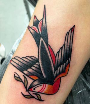 Get a classic swallow design inked on your arm in traditional style by talented artist Barney Coles.