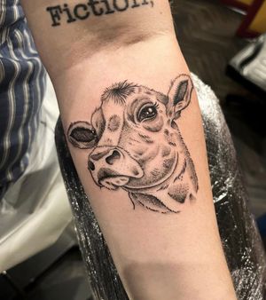 Capture the beauty of nature with this stunning realistic cow tattoo by Barney Coles. Perfect for animal lovers!