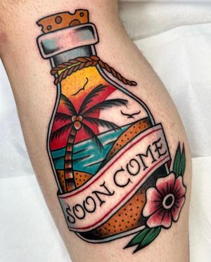 Capture the beauty of a sunset on the beach with this traditional small lettering tattoo featuring a flower, bottle, and palm tree by Barney Coles.