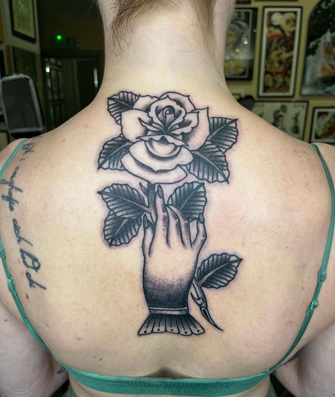 Hand Holding Rose Tattoo