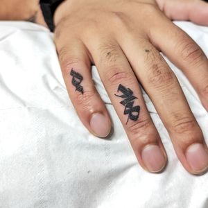Get custom lettering tattooed on your finger by the talented artist Chun Lee. Perfect for a unique and personal touch.