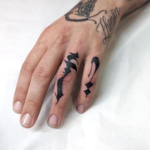 Express your inner voice with this elegant lettering tattoo on your finger, by the talented artist Chun Lee.
