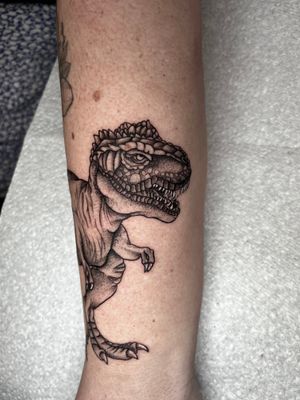 Get inked with a unique dotwork illustration of a T-Rex by the talented artist Claudia Whiteheart.