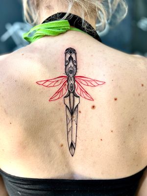 Discover the intricate beauty of dotwork and fine line in this illustrative piece by Claudia Whiteheart. The dagger symbolizes bravery and protection, while the wings represent freedom and spirituality.