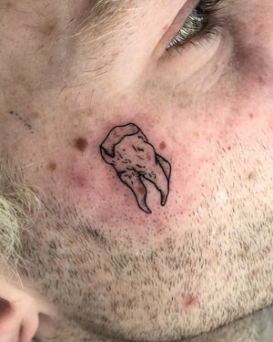 Get a unique illustrative tattoo featuring a woodcut design of a tooth, expertly done by artist Claudia Whiteheart.