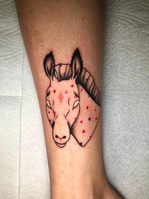 Get a unique illustrative tattoo of a horse with polka dot design by the talented artist Claudia Whiteheart.