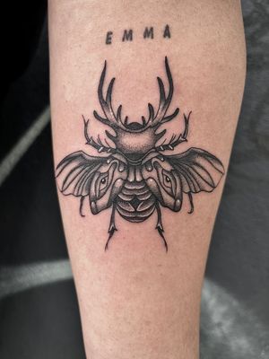 Unique dotwork tattoo of an atlas beetle by the talented artist Claudia Whiteheart. Detailed and stunning design.