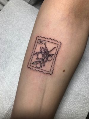 Get a unique and detailed stamp post tattoo by the talented artist Claudia Whiteheart. This fine line and illustrative style piece is perfect for those looking for a modern and artistic design.