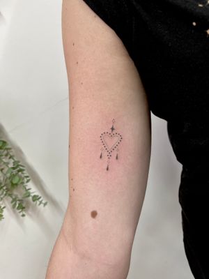 Beautiful and intricate heart design by Indigo Forever Tattoos, perfect for those who love ornamental tattoos.