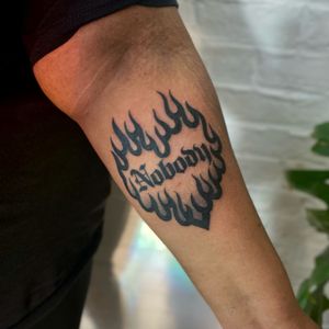 Express your fiery passion with this bold and beautiful tattoo design combining lettering and illustrative elements by the talented artist Jenny Dubet.