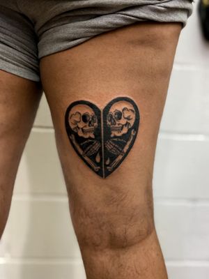 Get an intricate and unique tattoo of a heart and skull design done in fine line illustrative style by the talented artist Jenny Dubet.