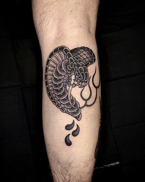Get captivated by Lamat's skilled dotwork technique in this illustrative traditional cobra tattoo design. Dare to be bold.
