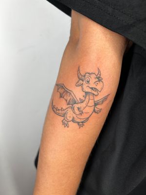 Adorn yourself with a whimsical dragon design by Jonathan Glick. This illustrative tattoo features intricate details and a charming appeal.