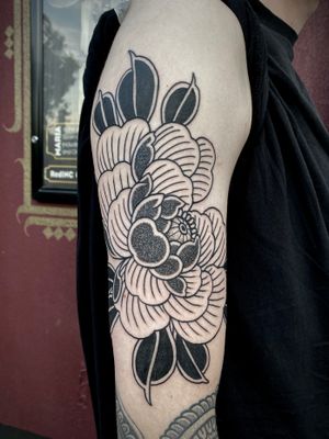 Experience the intricate beauty of dotwork and Japanese style in this stunning peony tattoo by the talented artist Lamat.