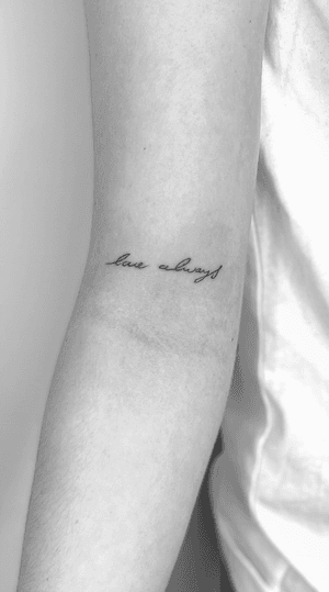 Get the perfect fine line and small lettering tattoo of 'love always' in cursive style by the talented artist Math.
