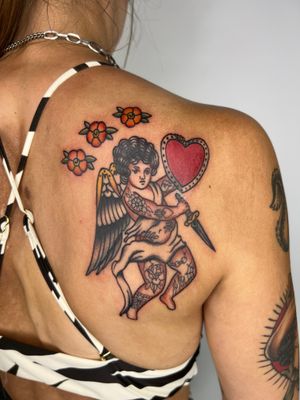 Beautifully crafted illustrative tattoo of a cherubic angel by Claudia Trash. Classic yet unique design that stands out.
