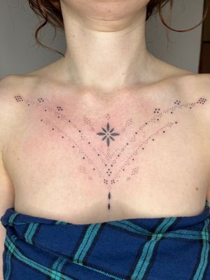 Adorn your chest with a stunning ornamental pattern tattoo by Indigo Forever Tattoos, crafted with intricate detail and precision.