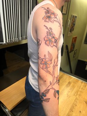 Check out this exquisite neo traditional tattoo of a flower and branch by talented artist Kiky Flore. Stunning details and delicate linework!