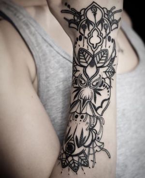 Experience the beauty of geometric lines and intricate patterns in this stunning mandala tattoo, expertly created by the talented artist Iva M.
